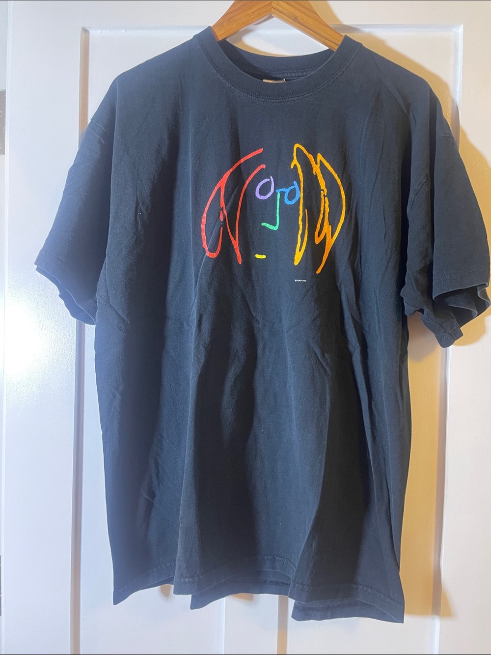 Women’s Black Graphic Tee with Multicolor John Lennon Self-Portrait Design